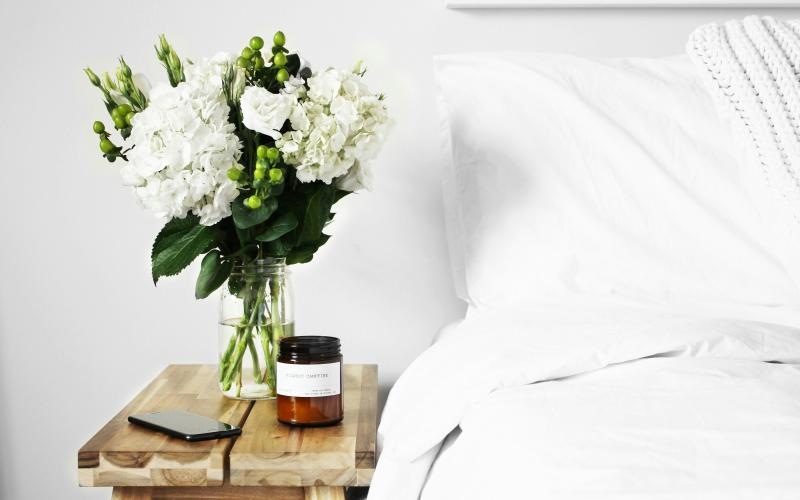 a vase of white flowers on a table