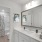 shower/tub combo in well lit bathroom