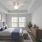 spacious bedroom with large windows