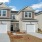 row of townhomes with private garages and driveways