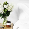 a vase of white flowers on a table